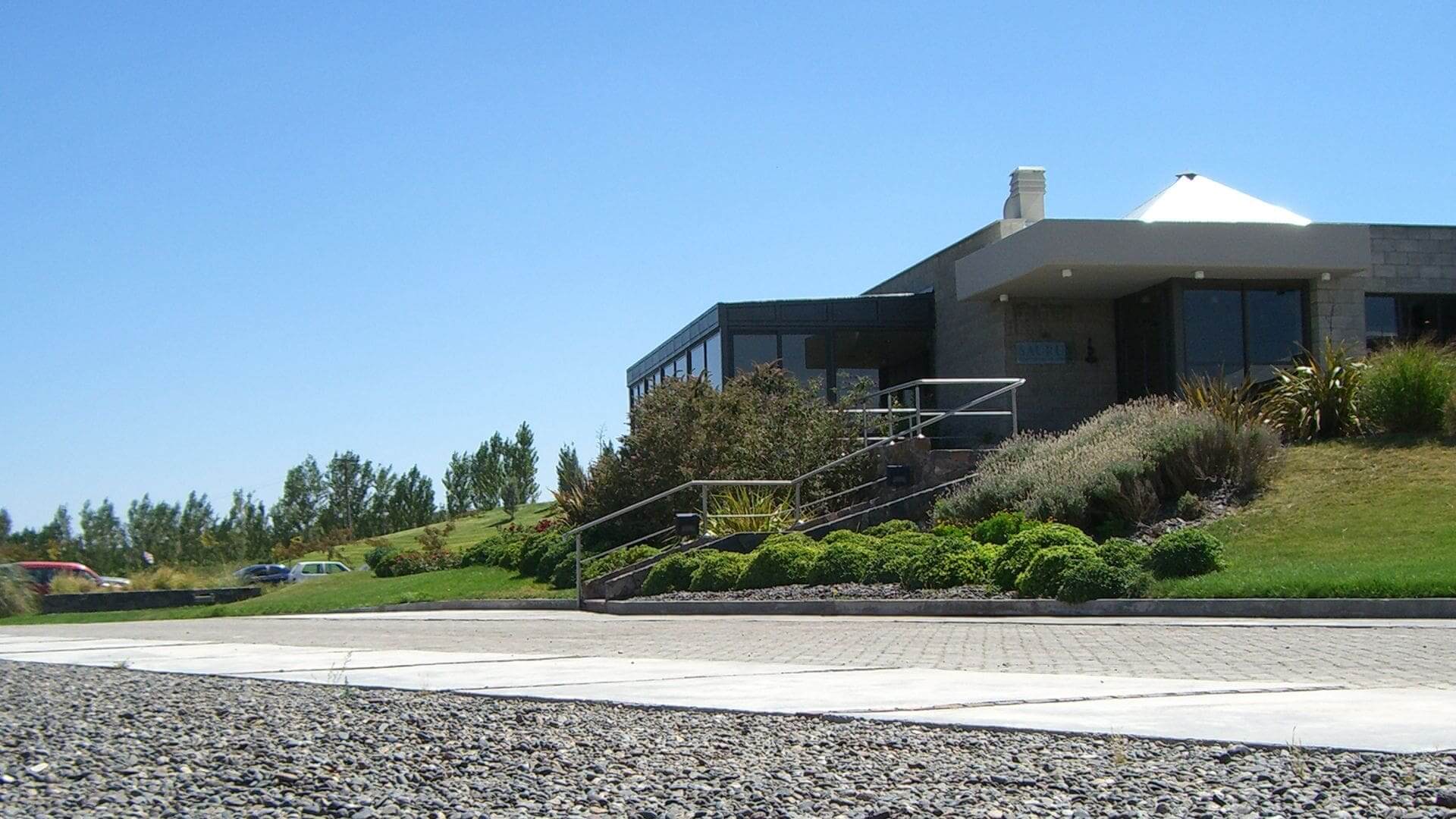 A house with a lot of bushes and trees