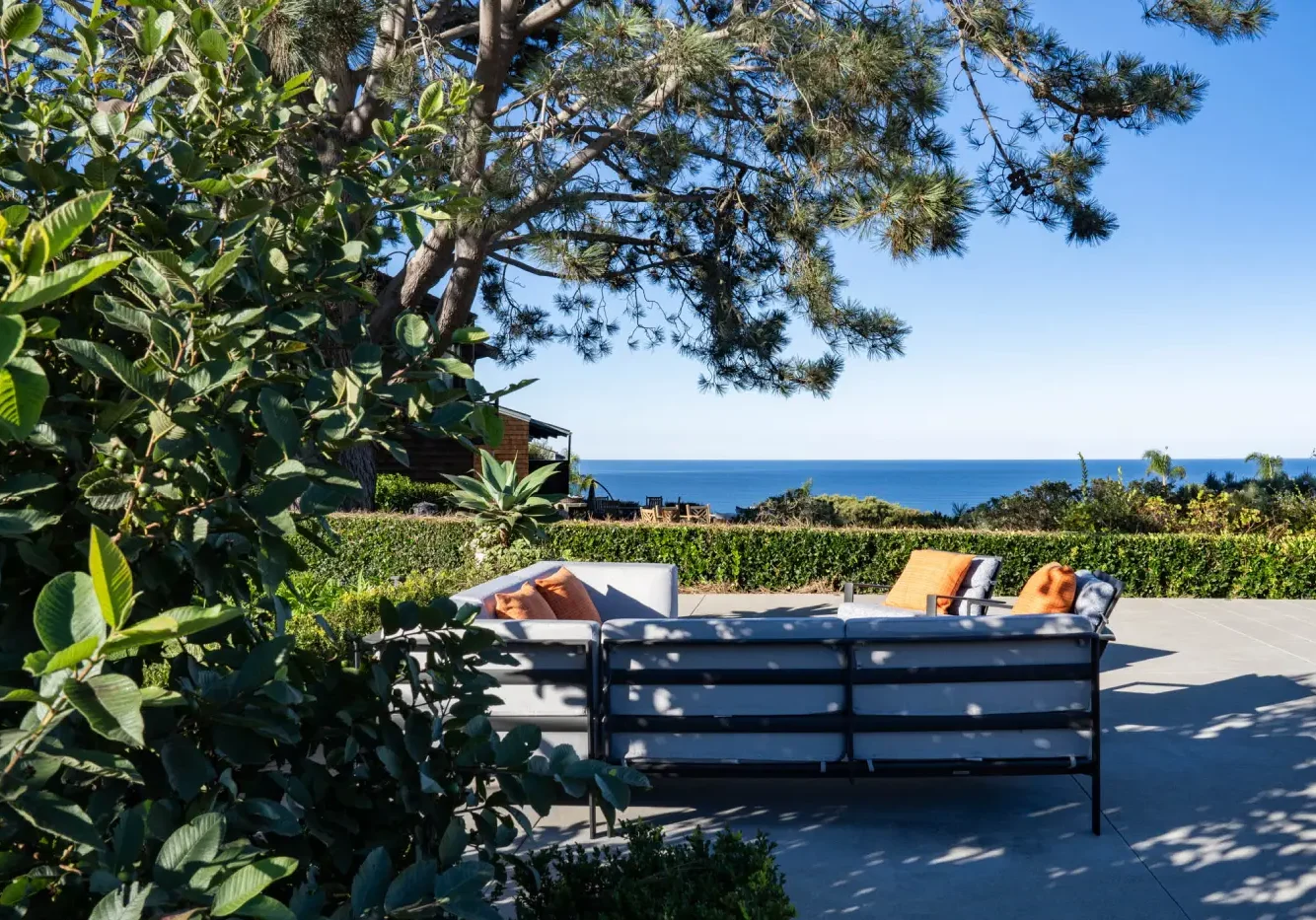 A view of the ocean from an outdoor patio.